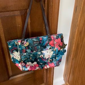 Sakroots shoulder bag and wallet set.